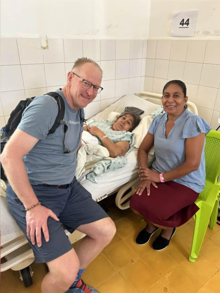 Dr. Berend sitting with a female Guatemalan patient